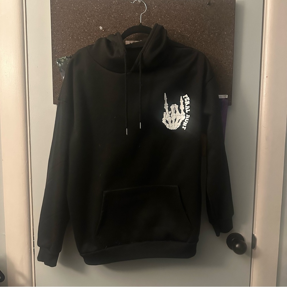 Black “Somebody’s Feral Aunt” hoodie
